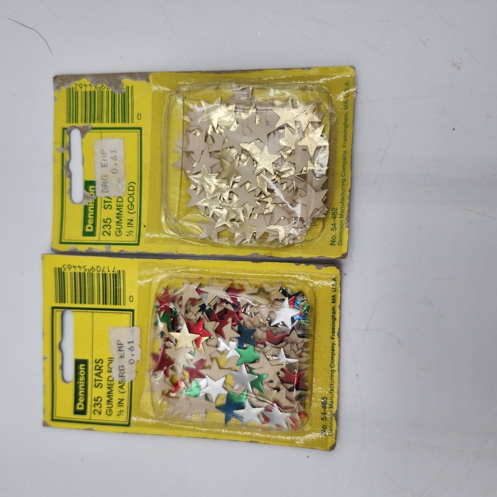 2 new Dennison brand gummed foil stars are labeled multicolor and gold