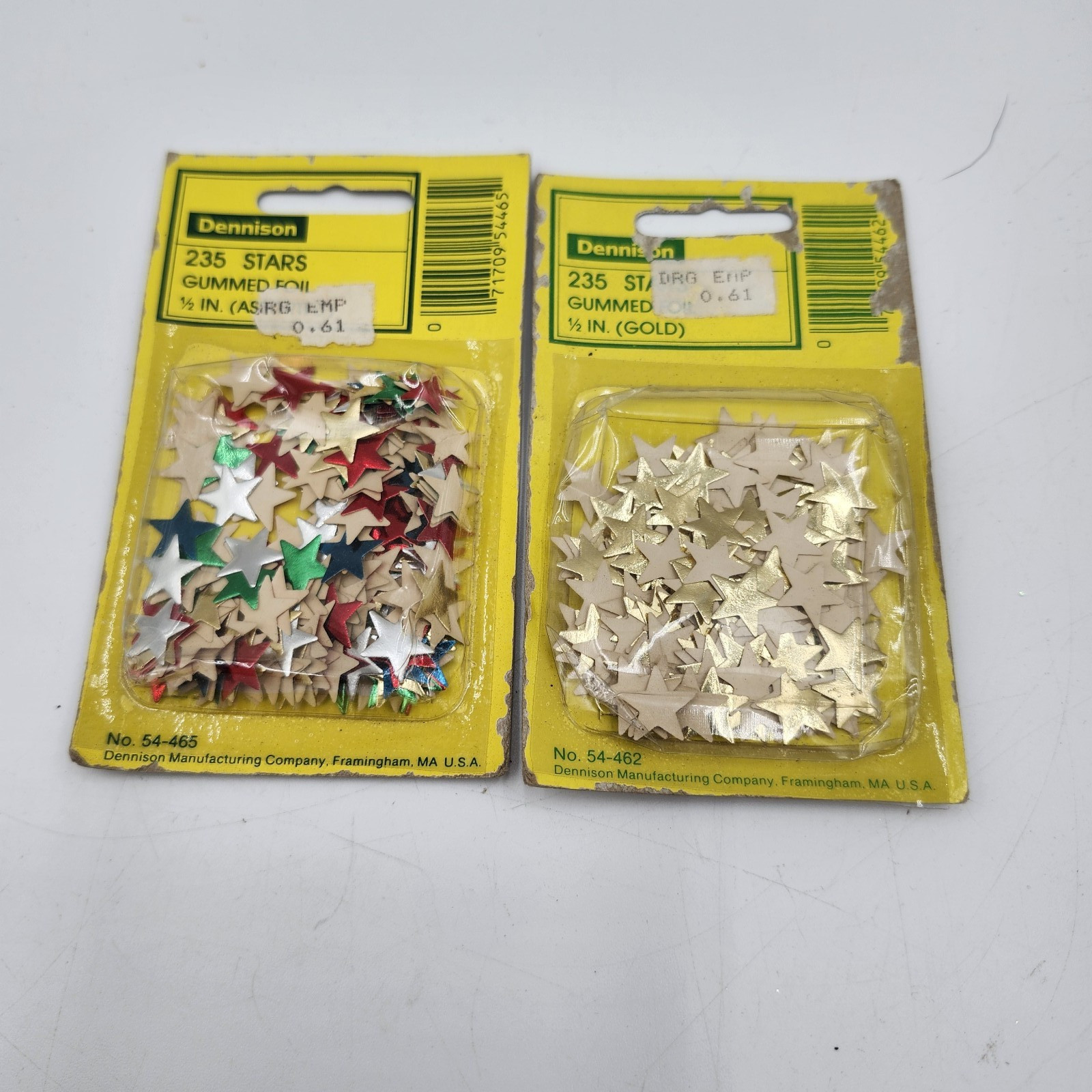 2 new Dennison brand gummed foil stars are labeled multicolor and gold