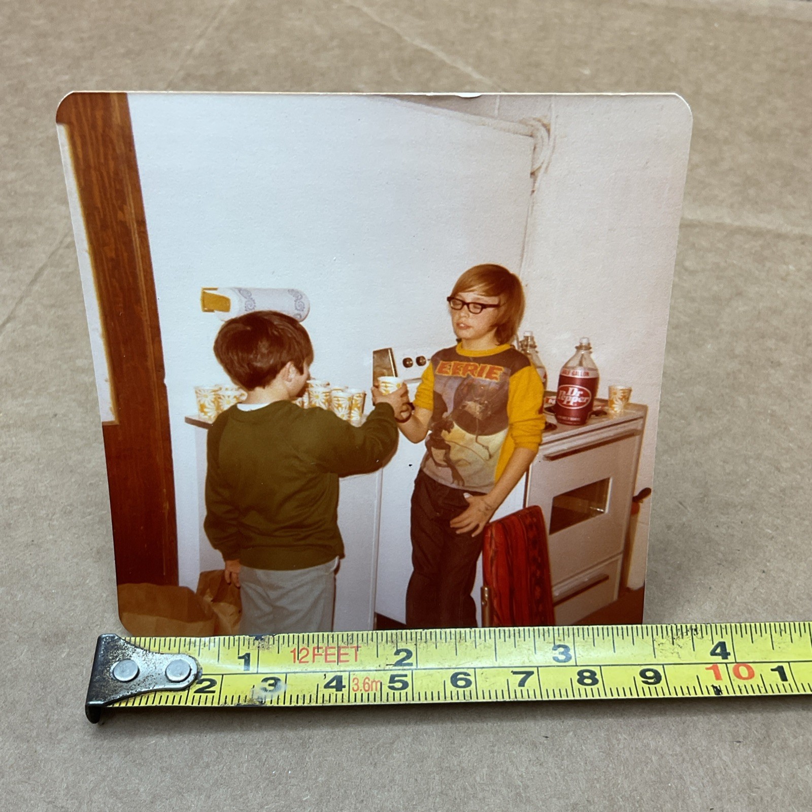 1970s Photo Of Young Boy Eerie Shirt Drinking Dr Pepper Paper Cups Kitchen B71
