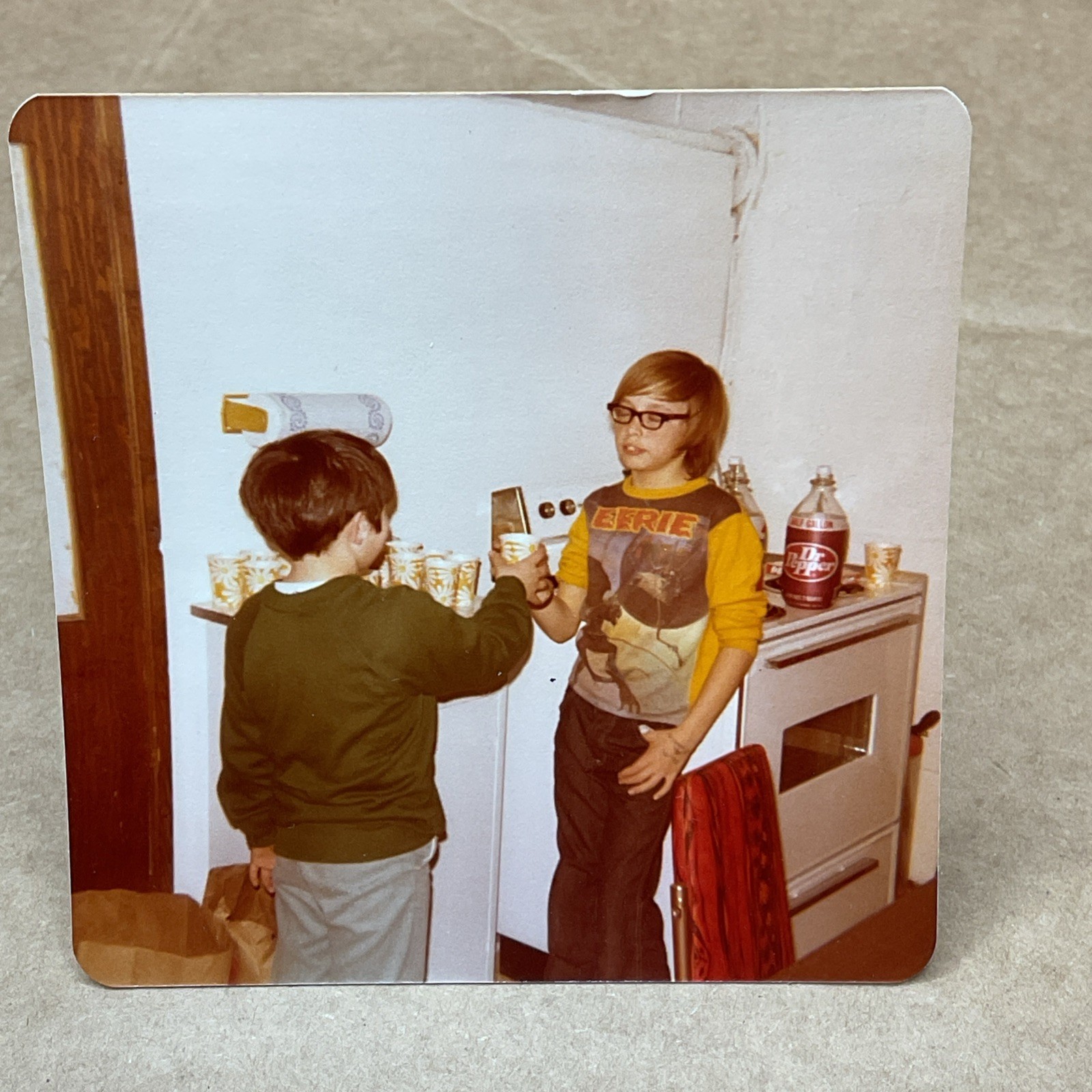 1970s Photo Of Young Boy Eerie Shirt Drinking Dr Pepper Paper Cups Kitchen B71