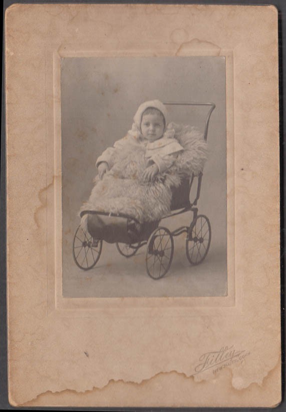 Child wrapped in fur in 4-wheel carriage photo Filley New Haven c 1910