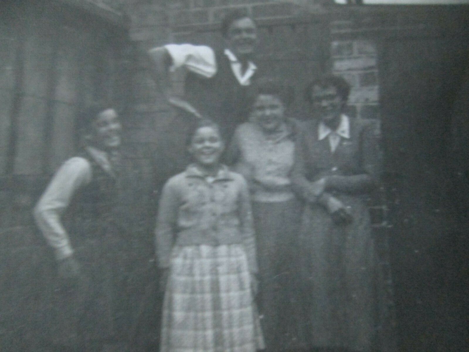 Photo of group of people (unknown location, date, names) 9 x 6.5 cm
