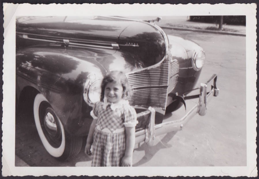 Little girl with sausage curls & plaid dress at 1940 Dodge vernacular photo