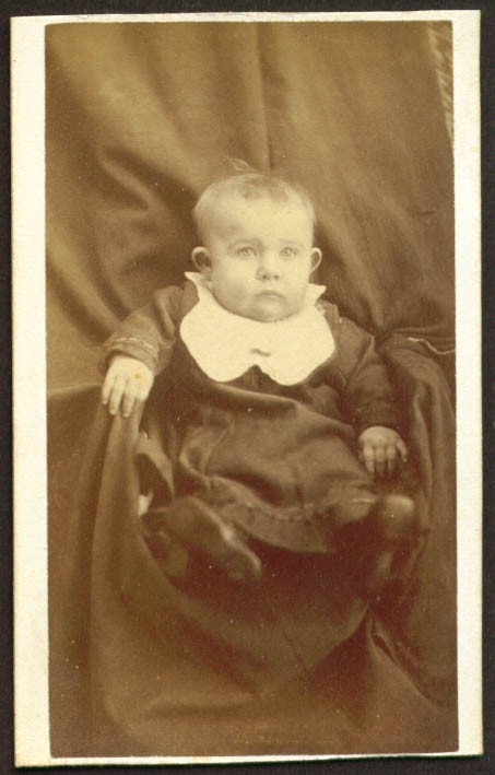 Jug-eared seated baby with bib CDV place unknown