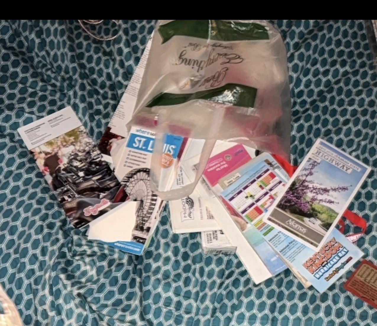 Bag of travel brochures and pamphlets, seemingly gathered from various locations
