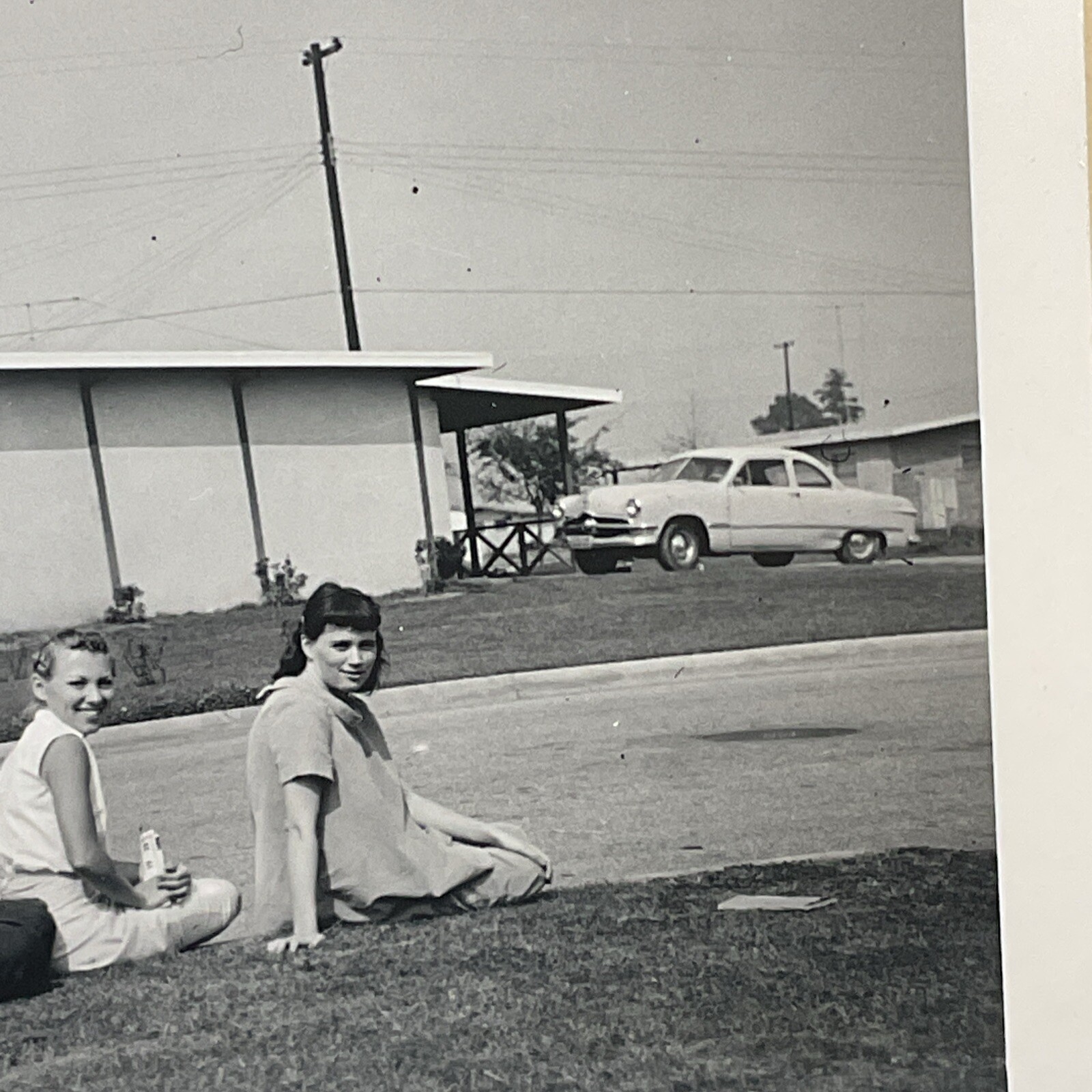 Mar 1957 Photograph 4 Women Sitting On Curb Lined Up Smiling Funny Weird B15A