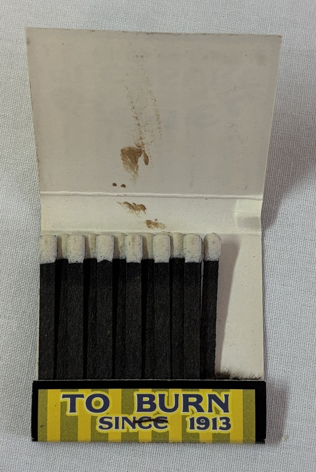 2000 matchbook ~ CAMEL CIGARETTES Pleasure To Burn Since 1913