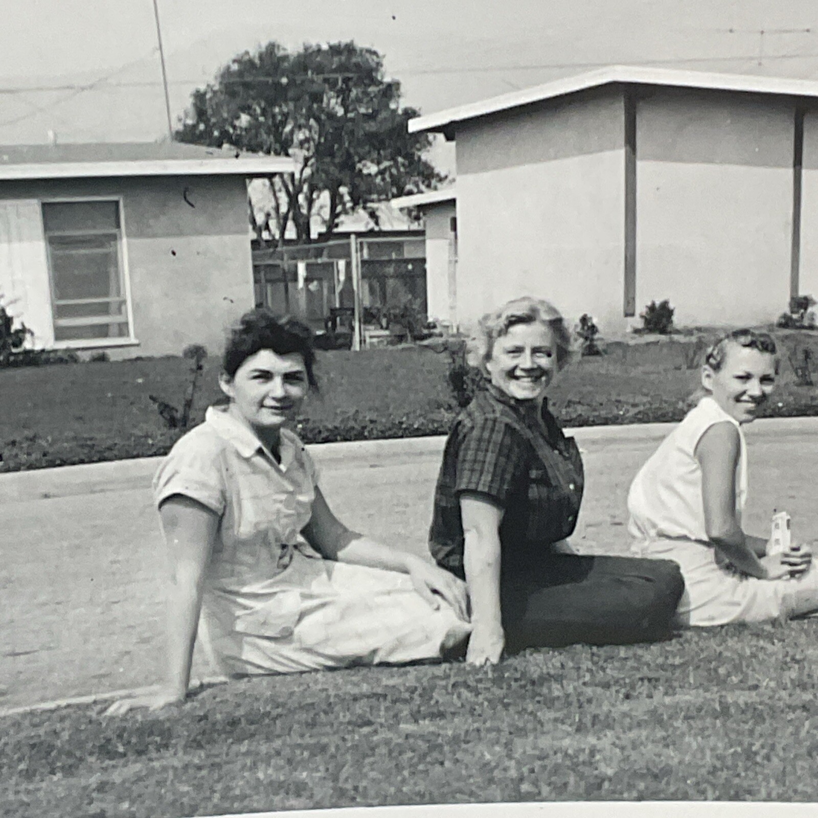 Mar 1957 Photograph 4 Women Sitting On Curb Lined Up Smiling Funny Weird B15A