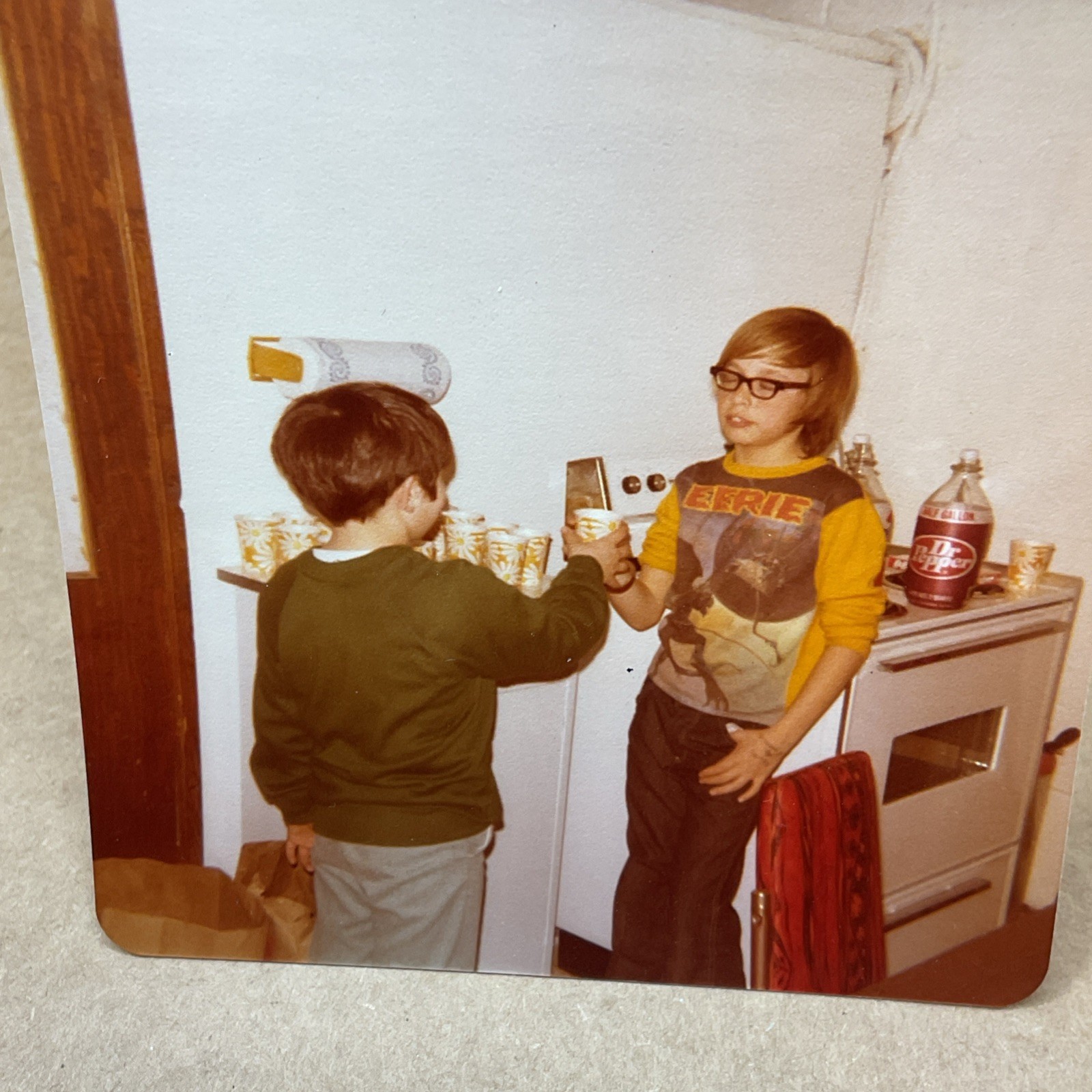 1970s Photo Of Young Boy Eerie Shirt Drinking Dr Pepper Paper Cups Kitchen B71